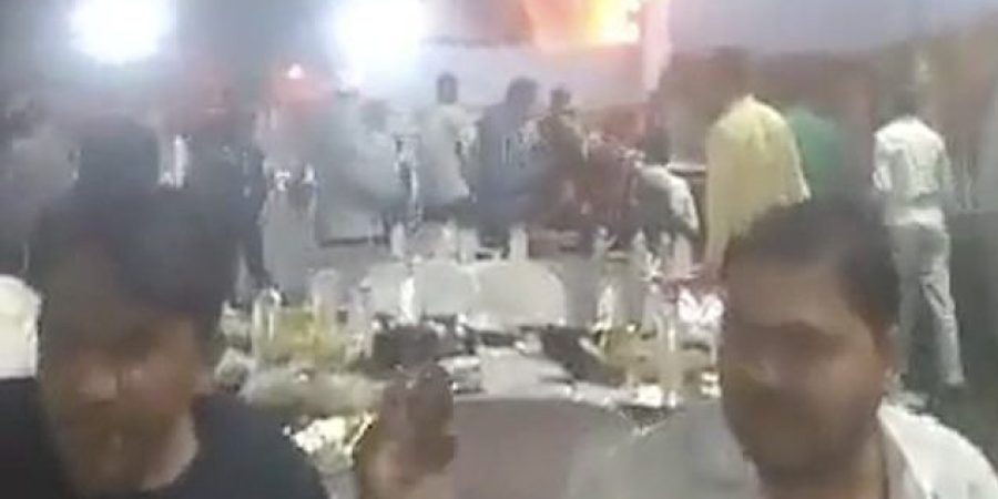 51125067-10255635-The_men_can_be_seen_chatting_in_the_footage_while_other_guests_f-a-4_1638432596562